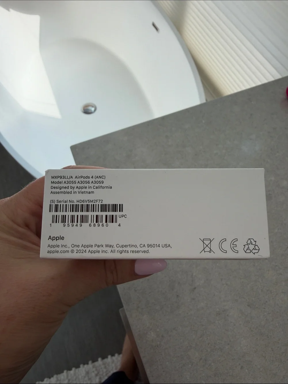 Apple AirPods 4 with active noise cancellation and charging case